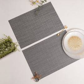 Set Of 2 Silver Geometric Design Woven Pvc Placemats