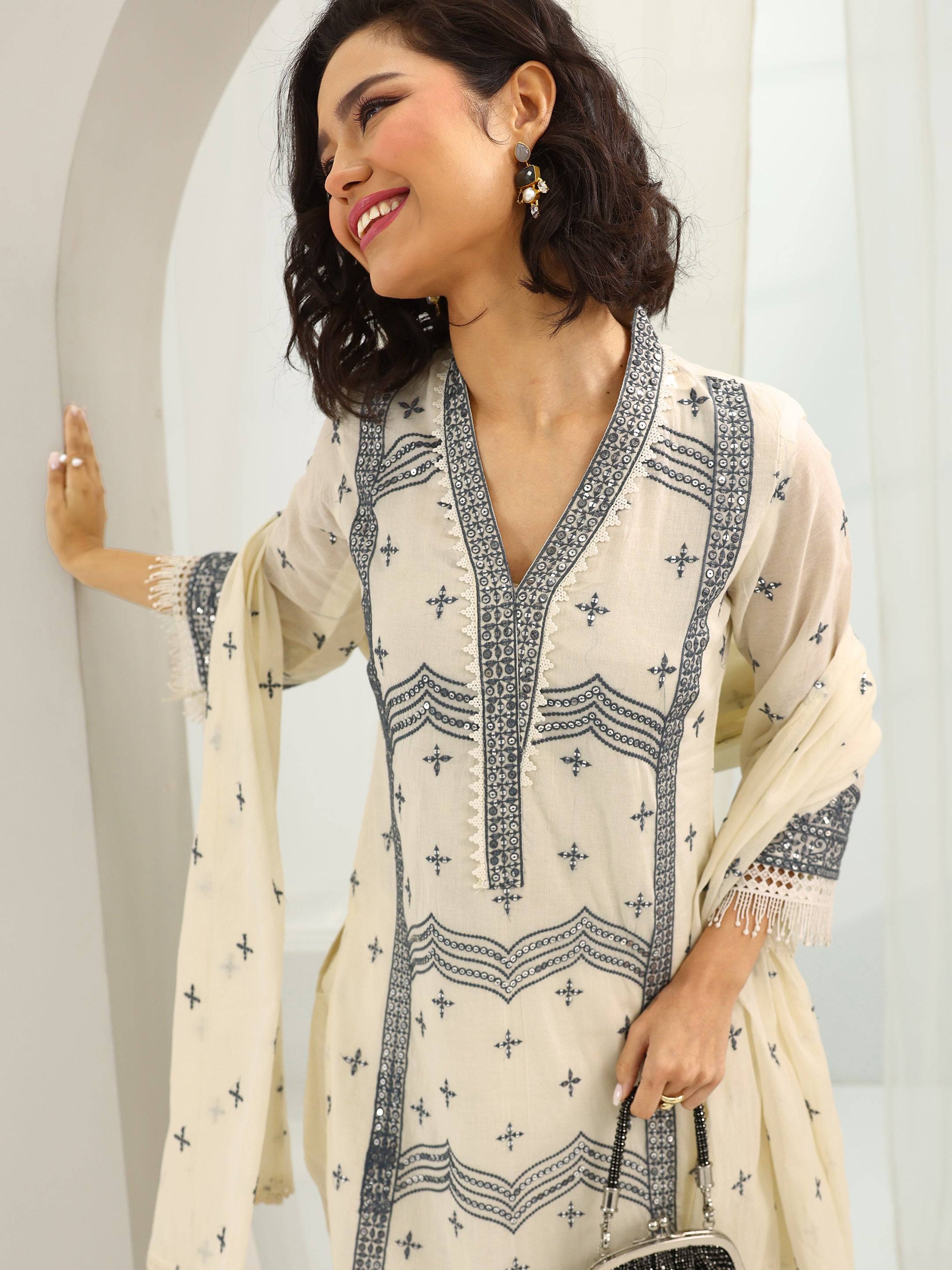 Off White Embroidered Cotton Straight S... Buy only at ₹5499