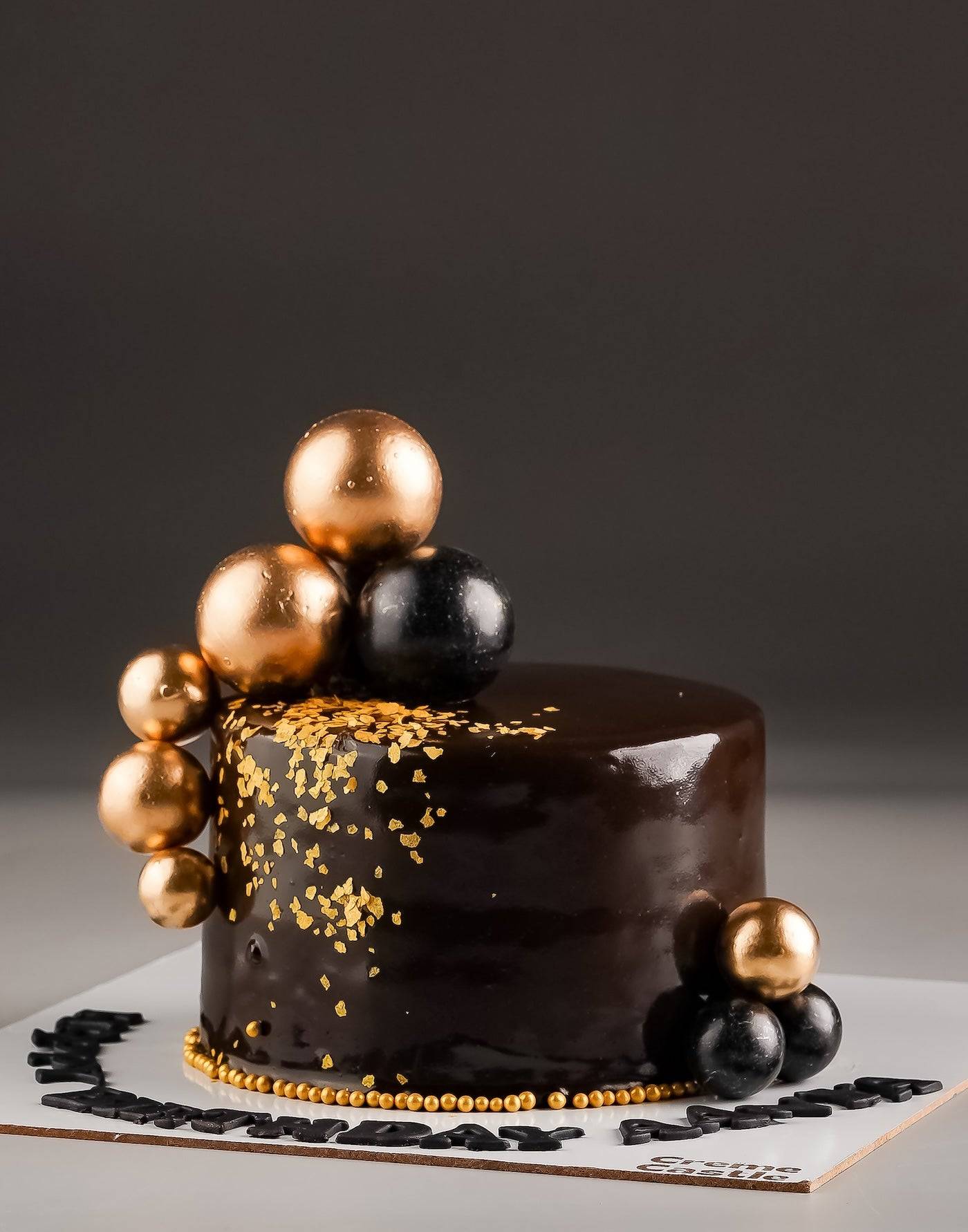 Black and Gold Anniversary Cake