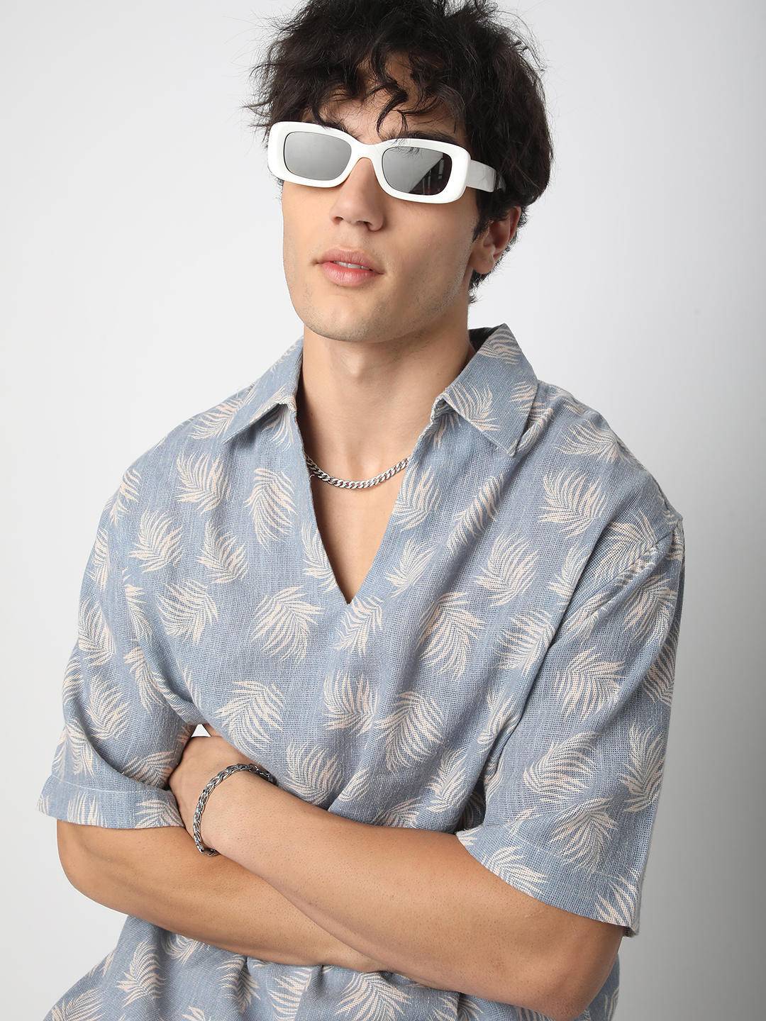 Powder Blue Coco Leaf Printed Burlap Oversized Polo Shirt Buy only at ₹759