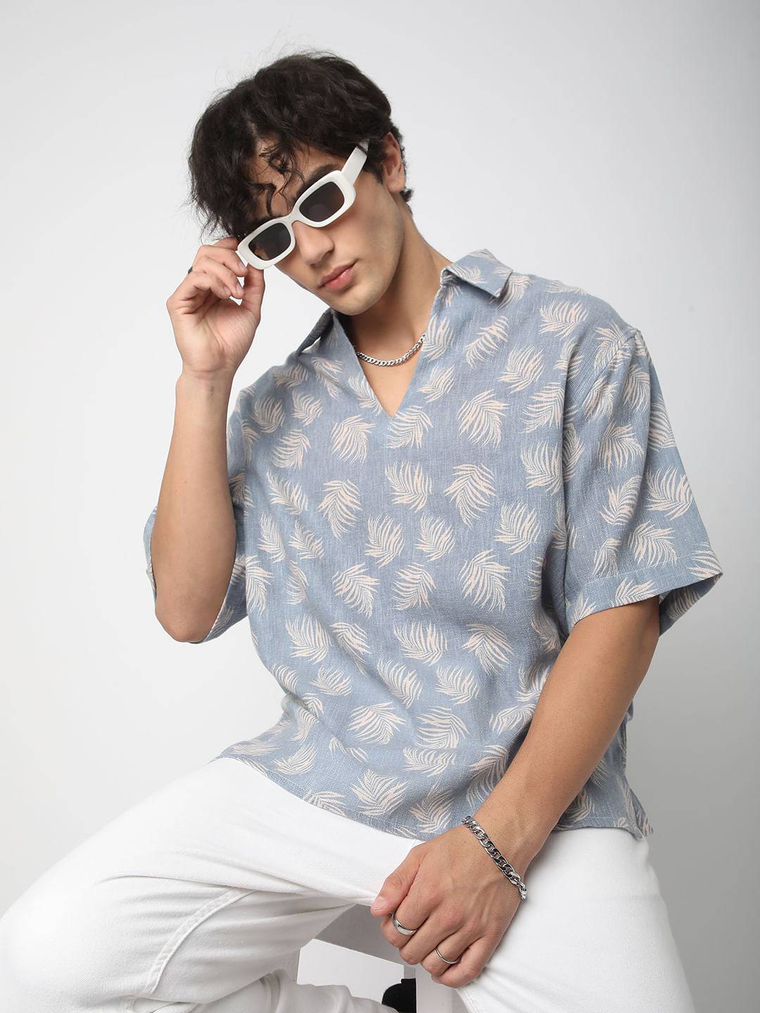 Powder Blue Coco Leaf Printed Burlap Oversized Polo Shirt Buy only at ₹759