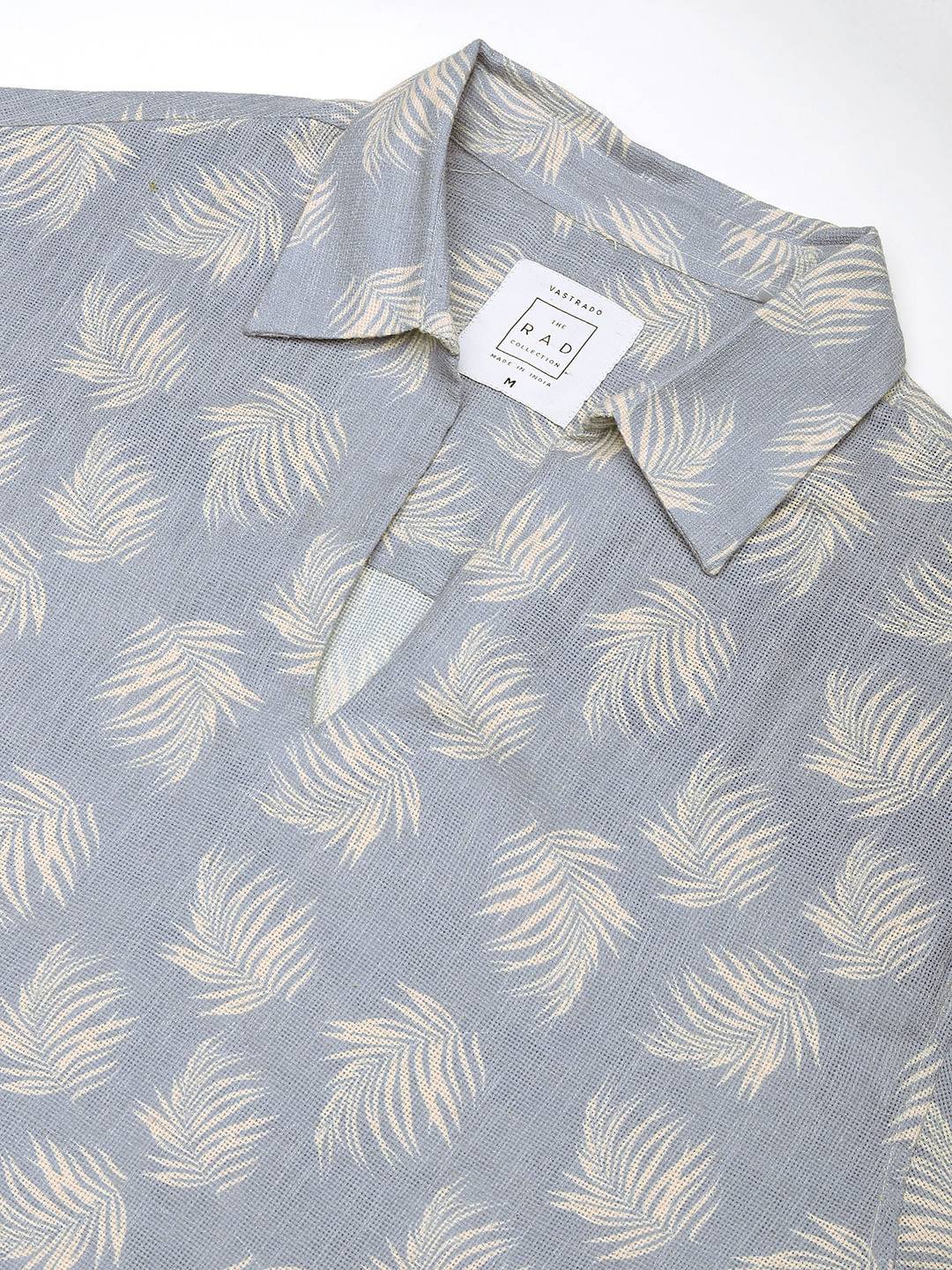 Powder Blue Coco Leaf Printed Burlap Oversized Polo Shirt Buy only at ₹759