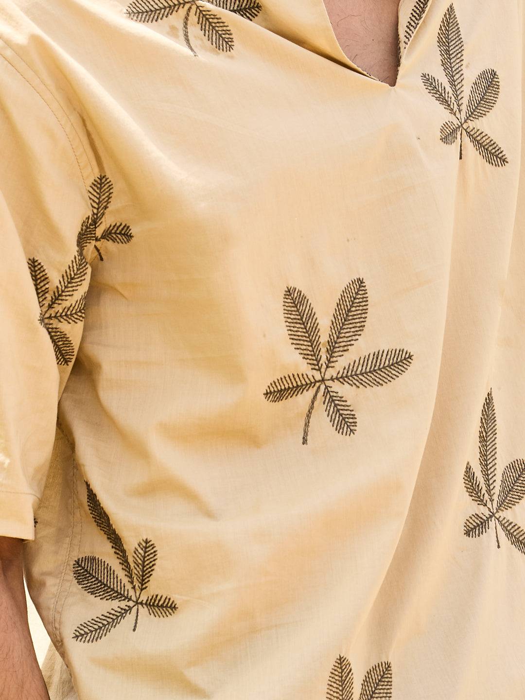 Coastal Breeze Palm Leaf Embroidered Khaki Oversized Polo Shirt Buy only at ₹759