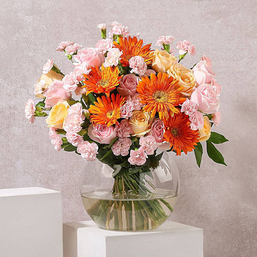 Bright Orange N Peach Blooms in Glass Vase