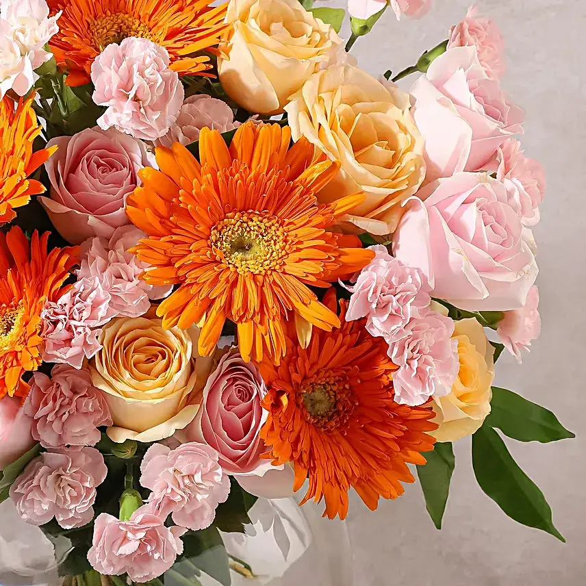 Bright Orange N Peach Blooms in Glass Vase