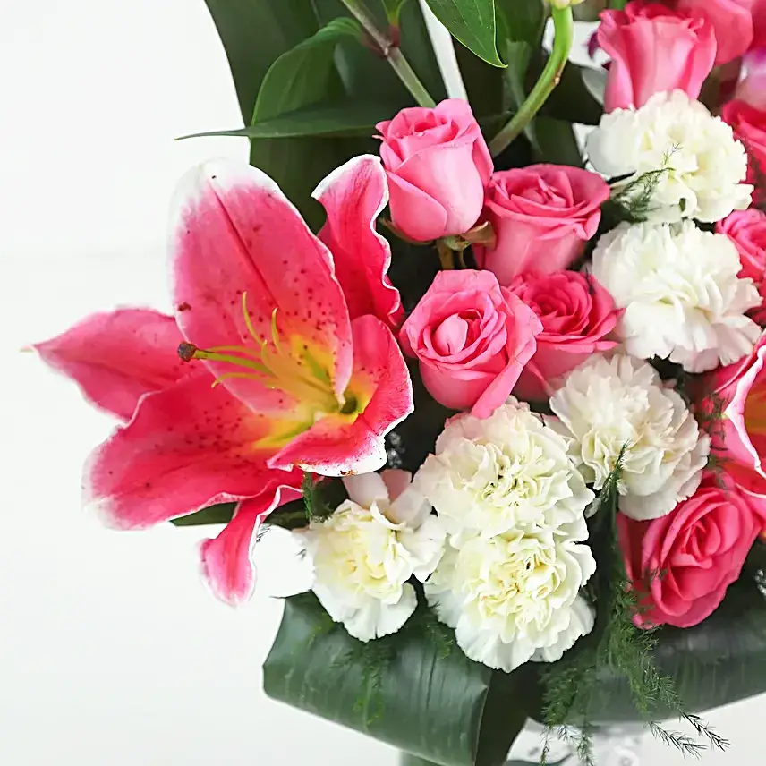 Elegant Mixed Flowers In Cylindrical Vase