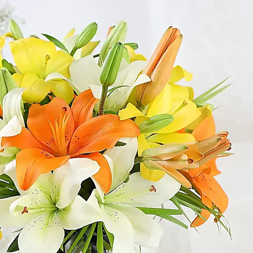 Mix Of Lilies In Fishbowl Vase