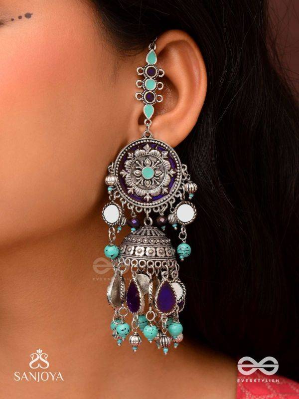RATNA TILAKA-JEWEL ADORNMENT- EARRINGS ENAMELLED IN SHADES OF BLUE AND BLACK, ACCENTED WITH GHUNGROO BEADS AND OXIDIZED JHUMKI