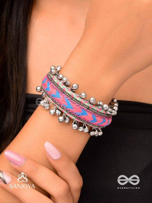 CHITRA DHARA – FLOW OF COLORS   EMBROIDERED BRACELET WITH A MIX OF COLORS AND INTRICATE THREAD WORK, ADORNED WITH GHUNGROO'S