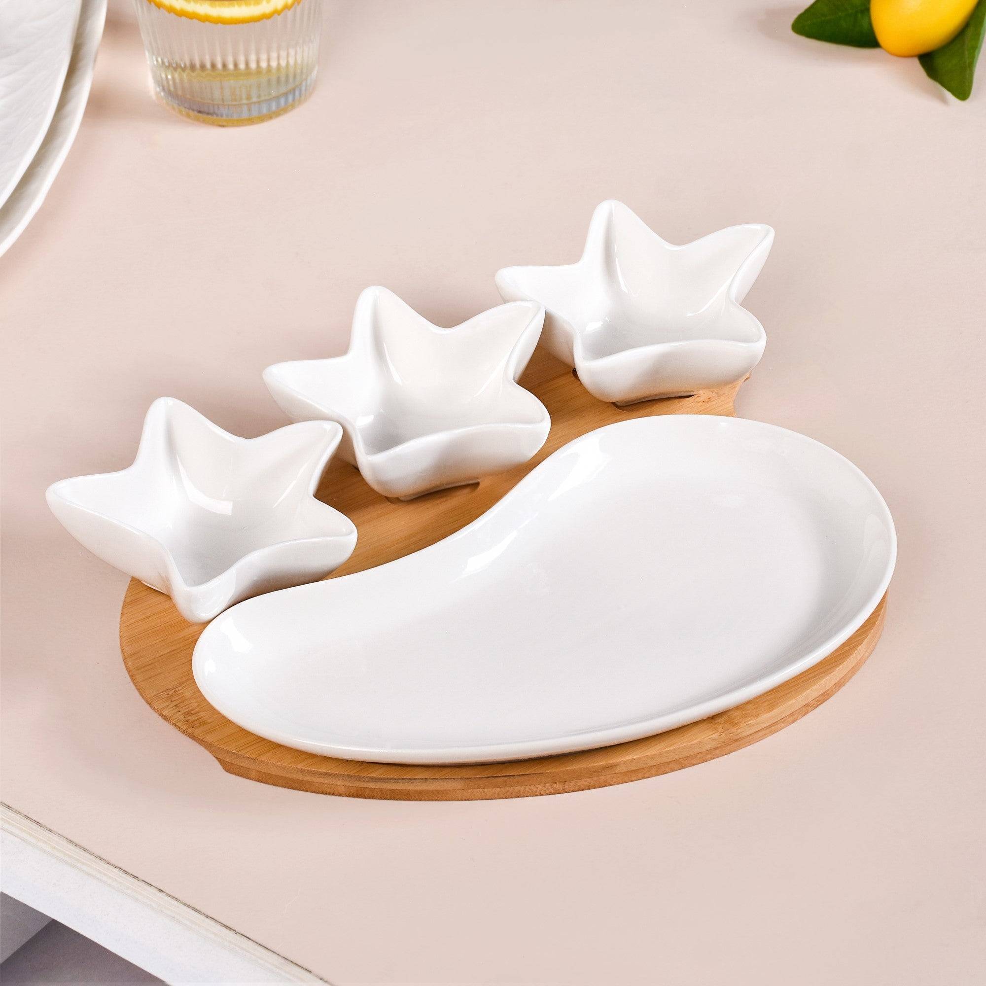 Set Of 4 Stars And Comet Ceramic Serveware With Tray buy only at ₹1590